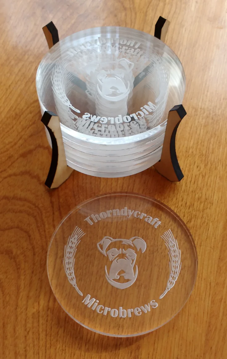 Set of clear acrylic coasters laser-engraved with the Thorndycraft Microbrews logo